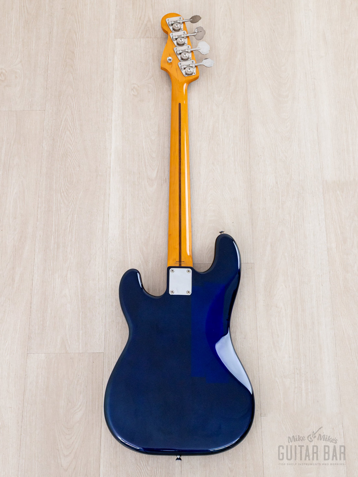 Full back of blue Precision Bass, maple neck