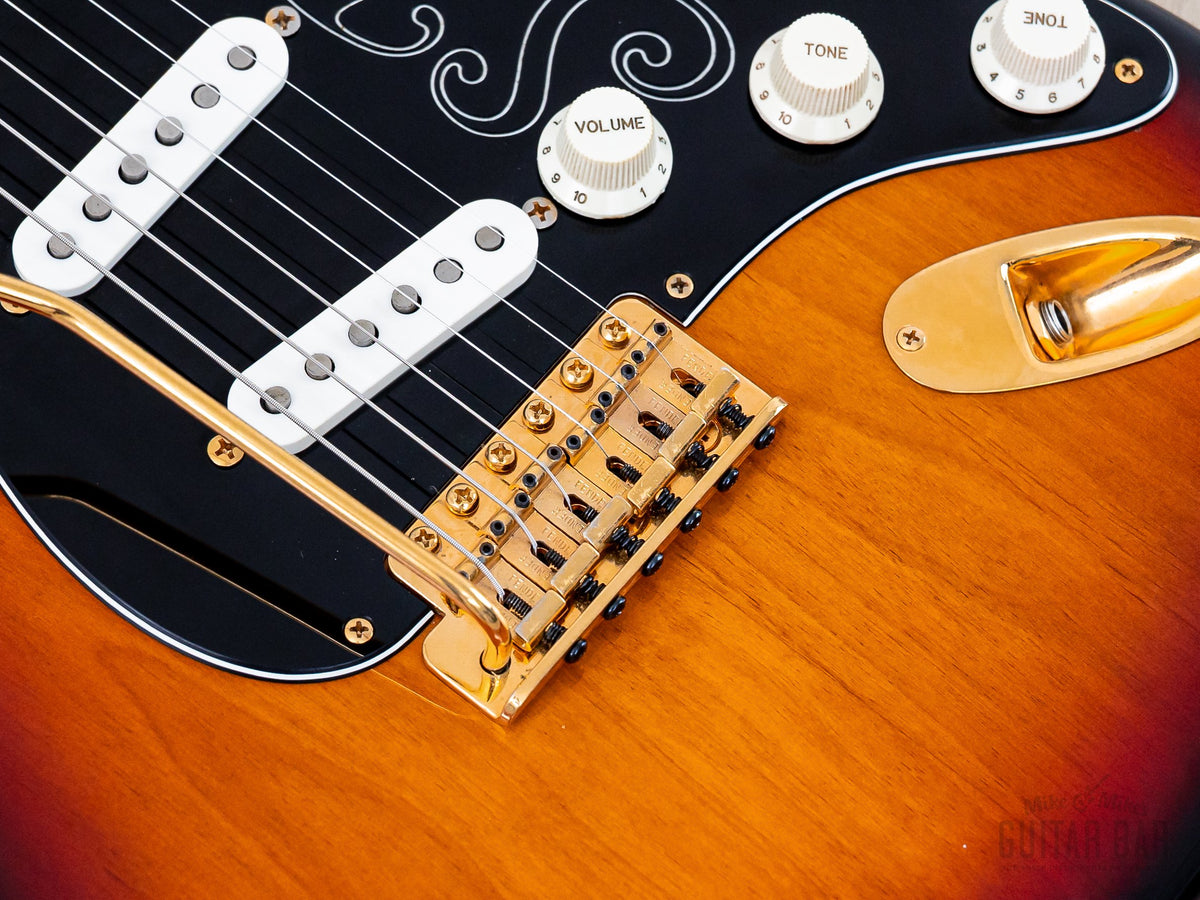 Close-up of gold Synchronized Tremolo bridge and pickups
