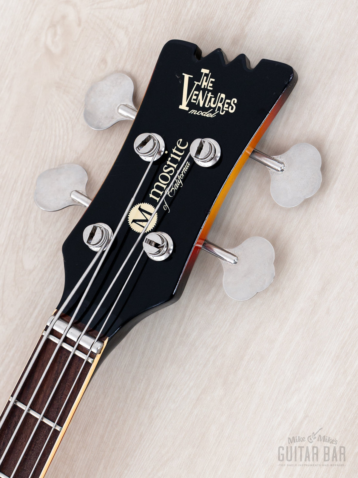 Mosrite Ventures Bass headstock front with The Ventures logo