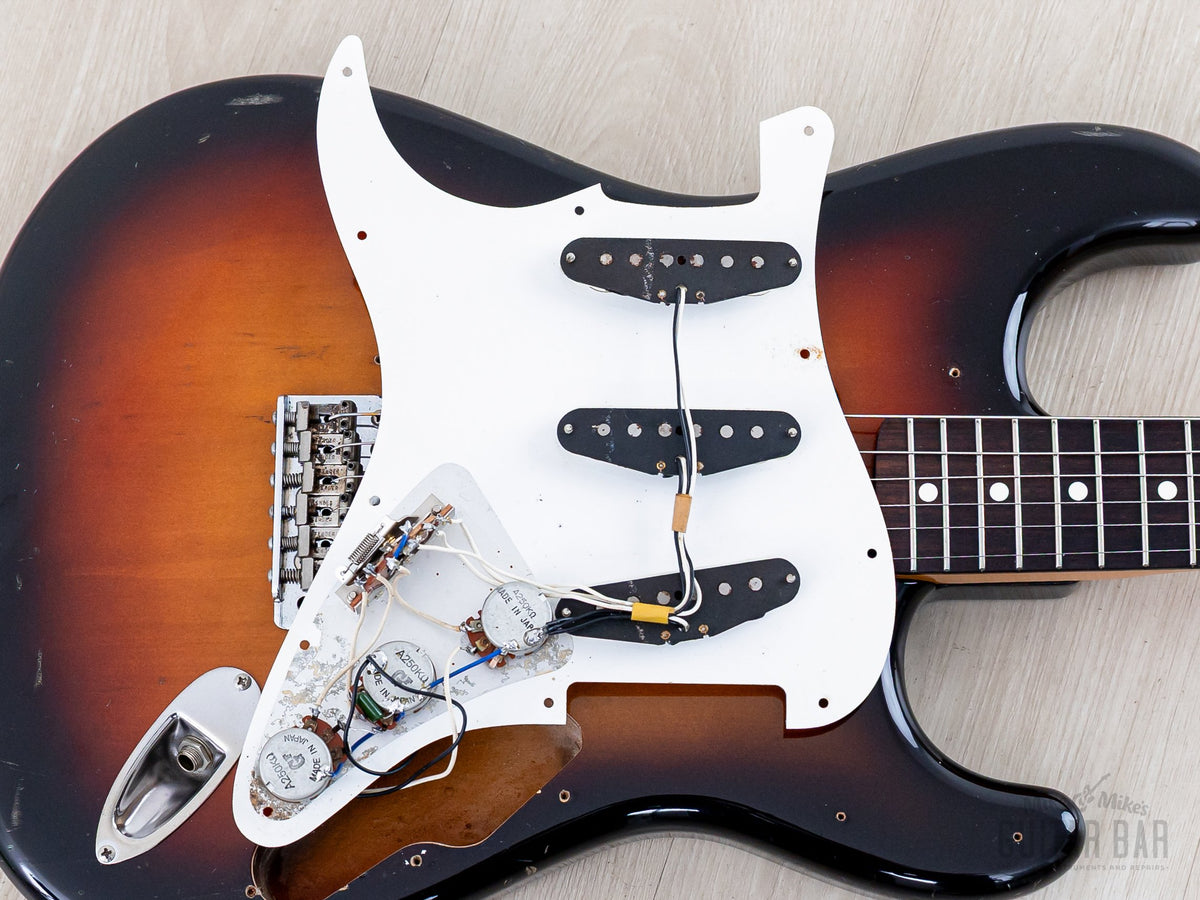 Pickguard lifted showing pickups and wiring