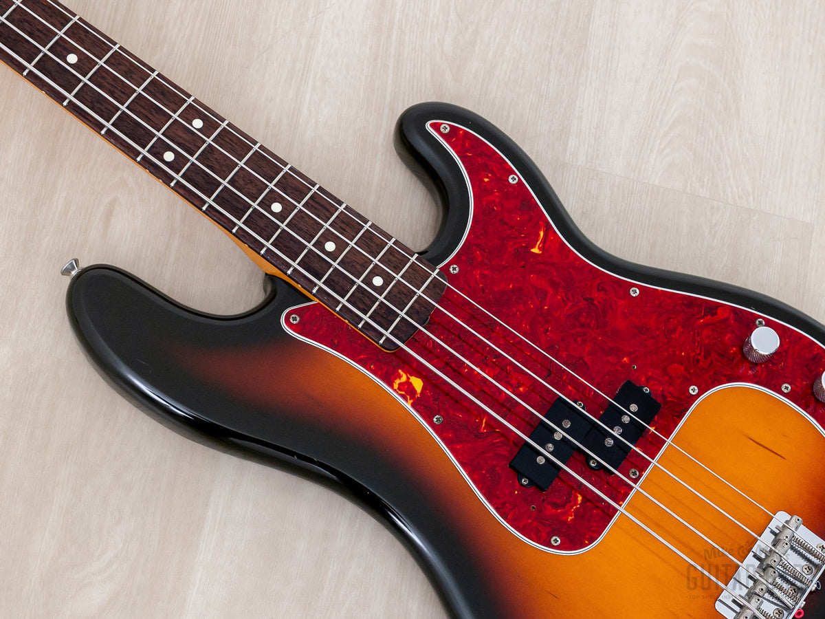 Close-up of pickguard, pickup and knurled knobs