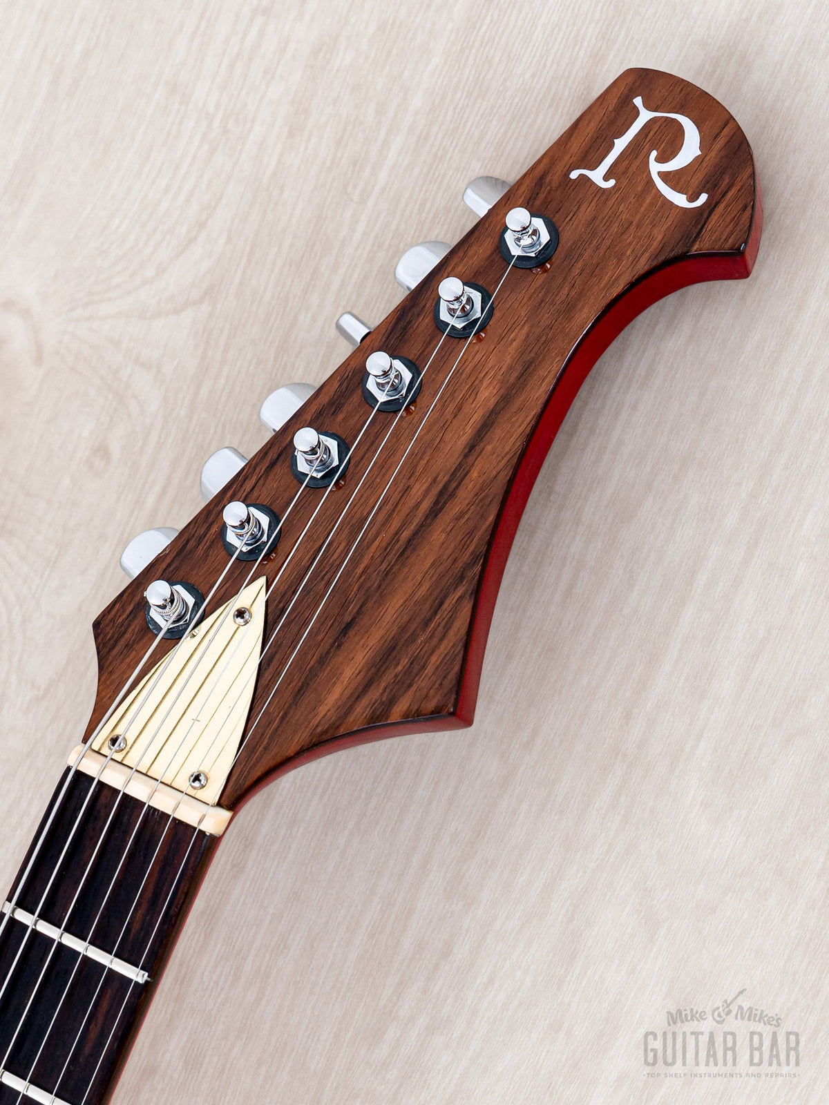 BC Rich Eagle headstock front with rosewood veneer and R inlay