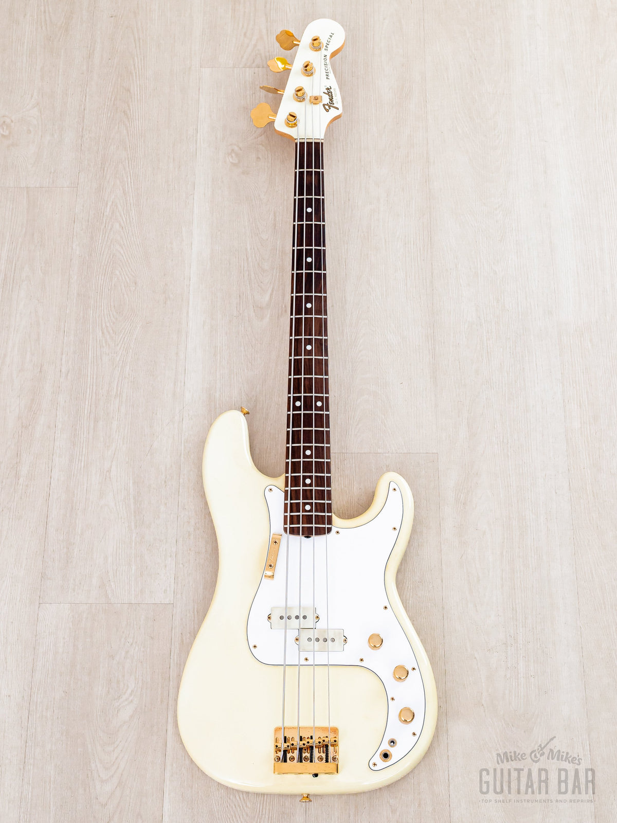 Full front of Olympic White Precision Special with gold hardware