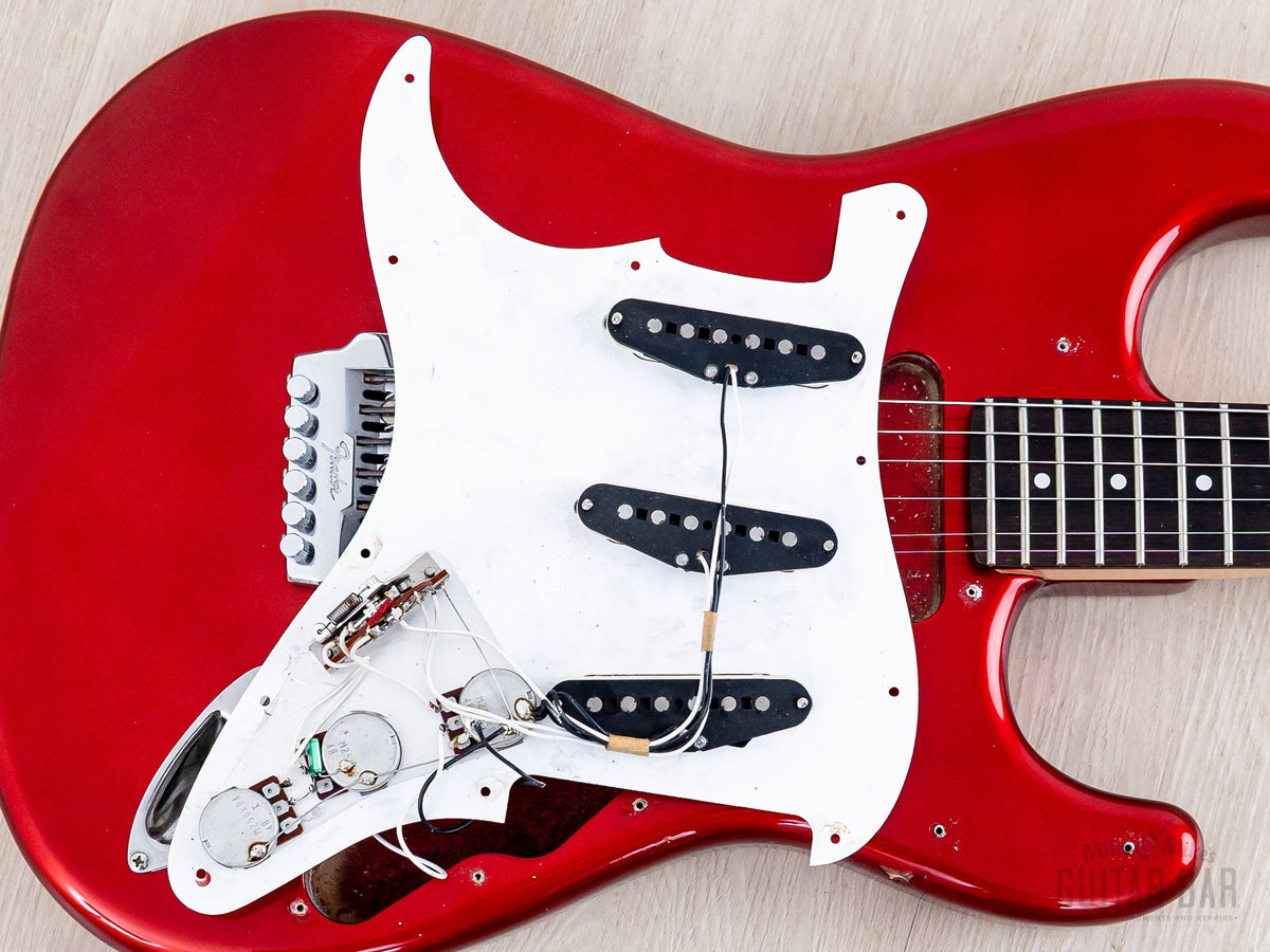 Pickguard lifted showing pickups and wiring