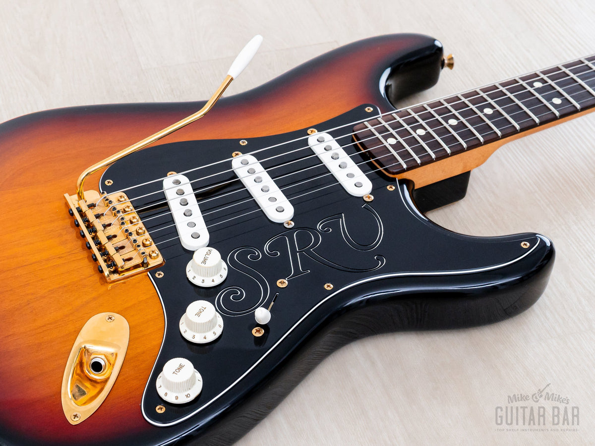 Close-up of Sunburst body, black SRV pickguard and Texas Special pickups
