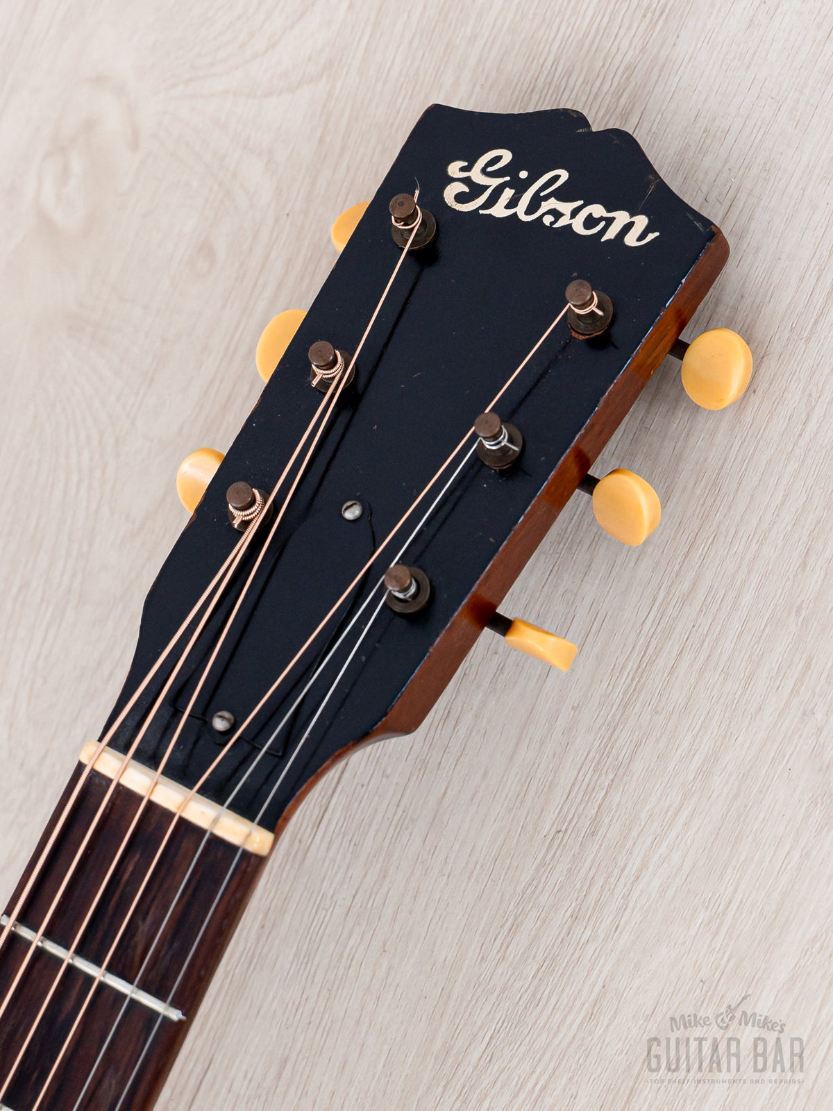 1937 Gibson L-37 headstock front with Gibson logo