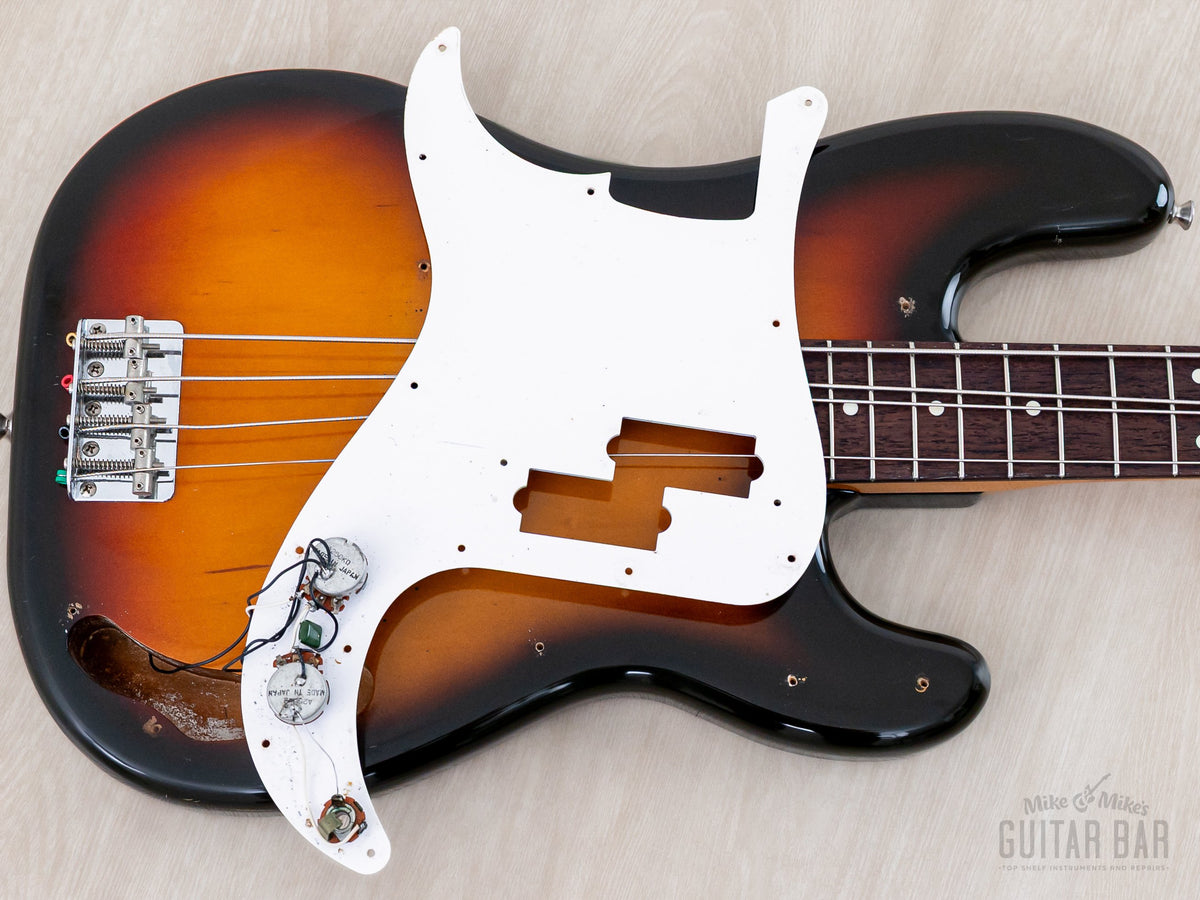 Body with pickguard lifted, showing pickup and underside