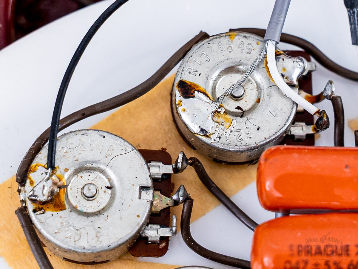 1987 Rickenbacker 360/12V64 pots and capacitors close-up