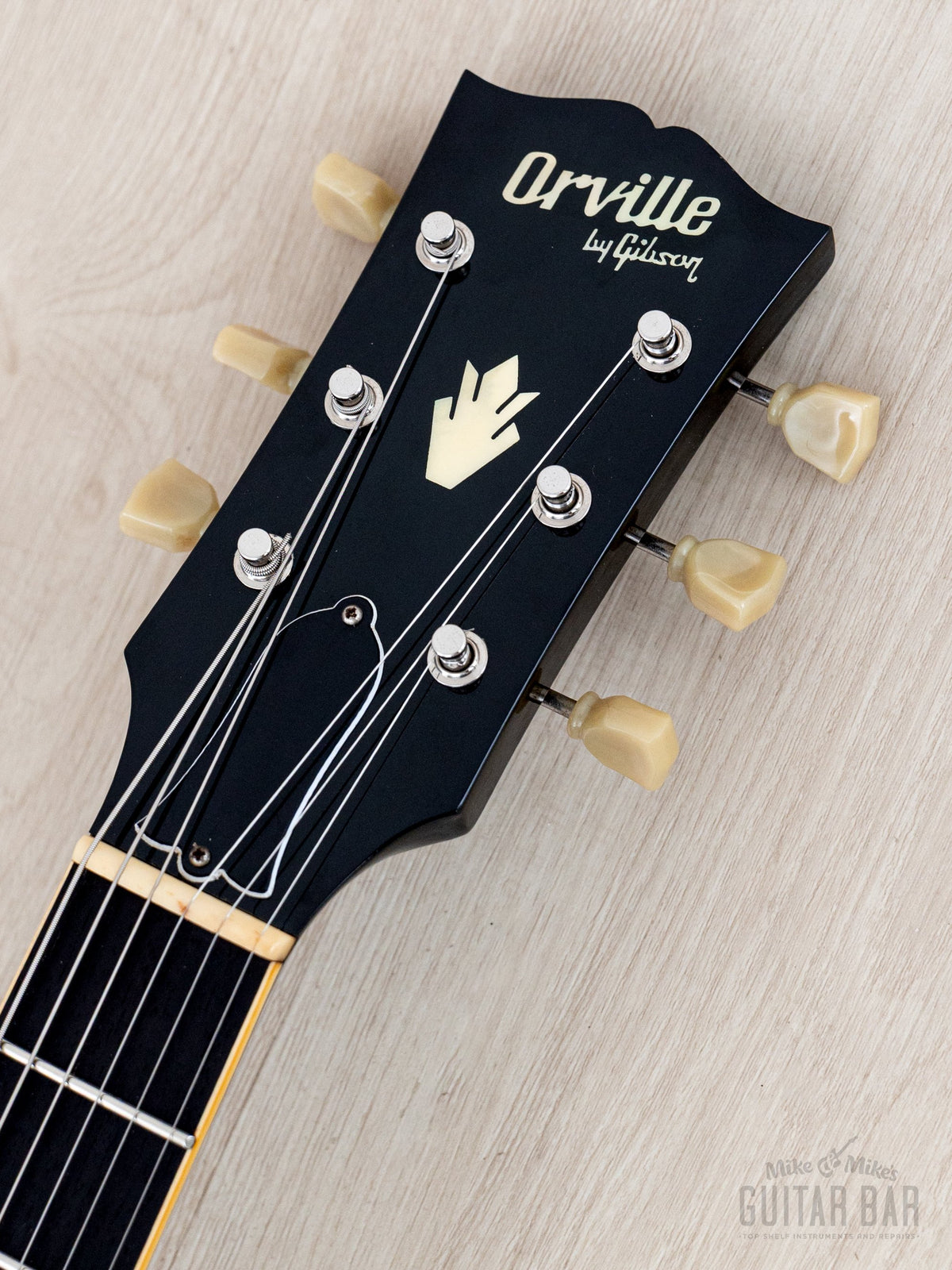 1989 Orville ES-335 headstock front with Orville logo