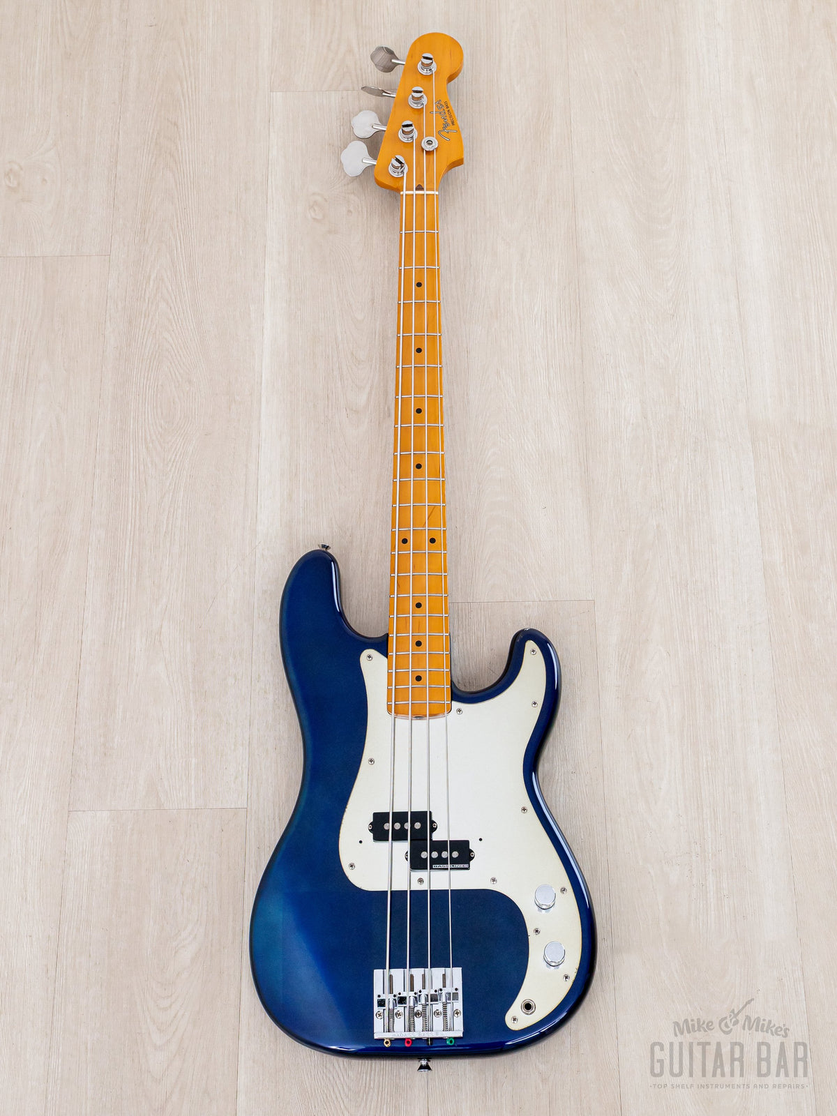 Full front of blue Precision Bass with mirrored pickguard