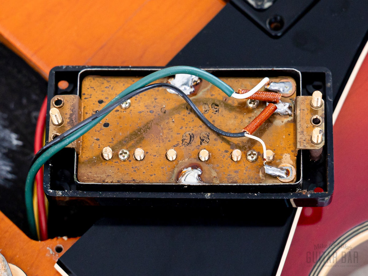 Yamaha SG1000 humbucker baseplate date stamp close-up