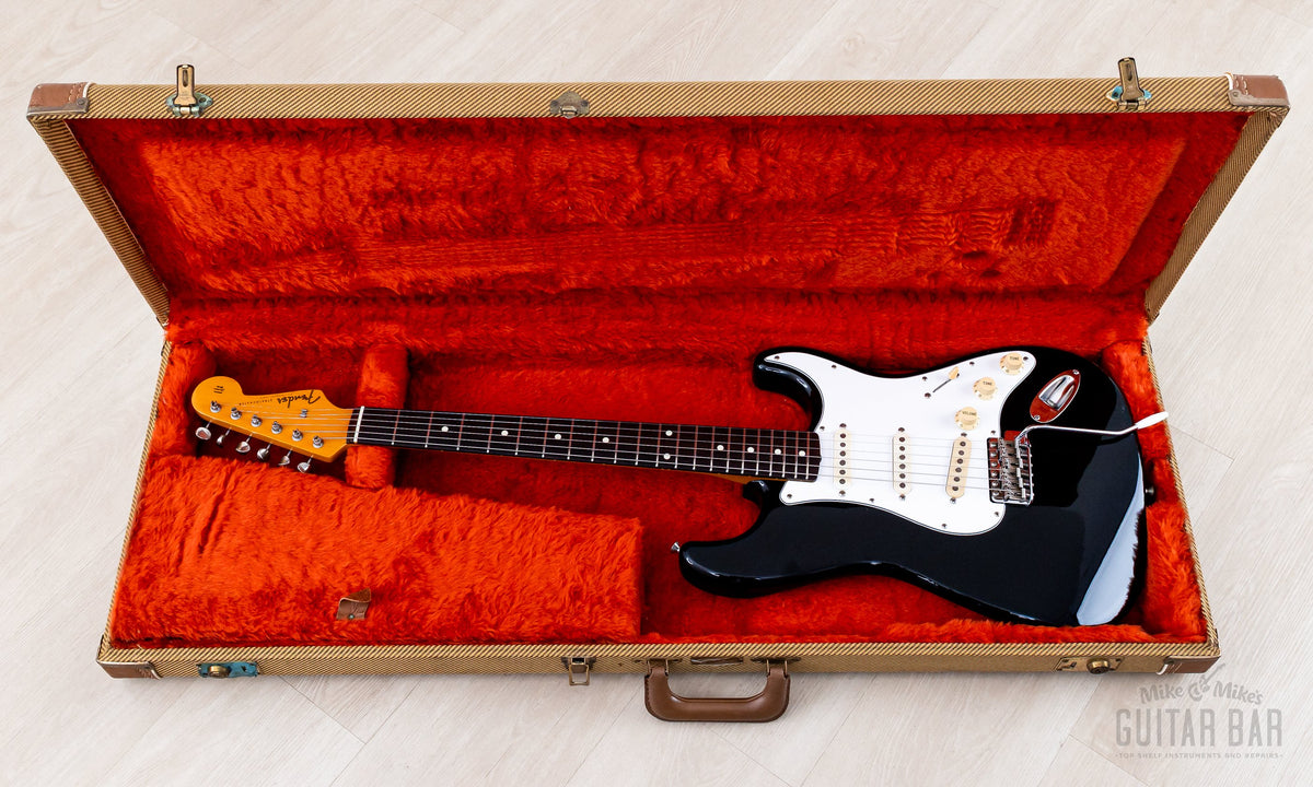 Guitar in the open tweed hardshell case