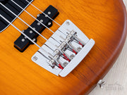 Close-up of Mustang bridge with barrel saddles and J pickup