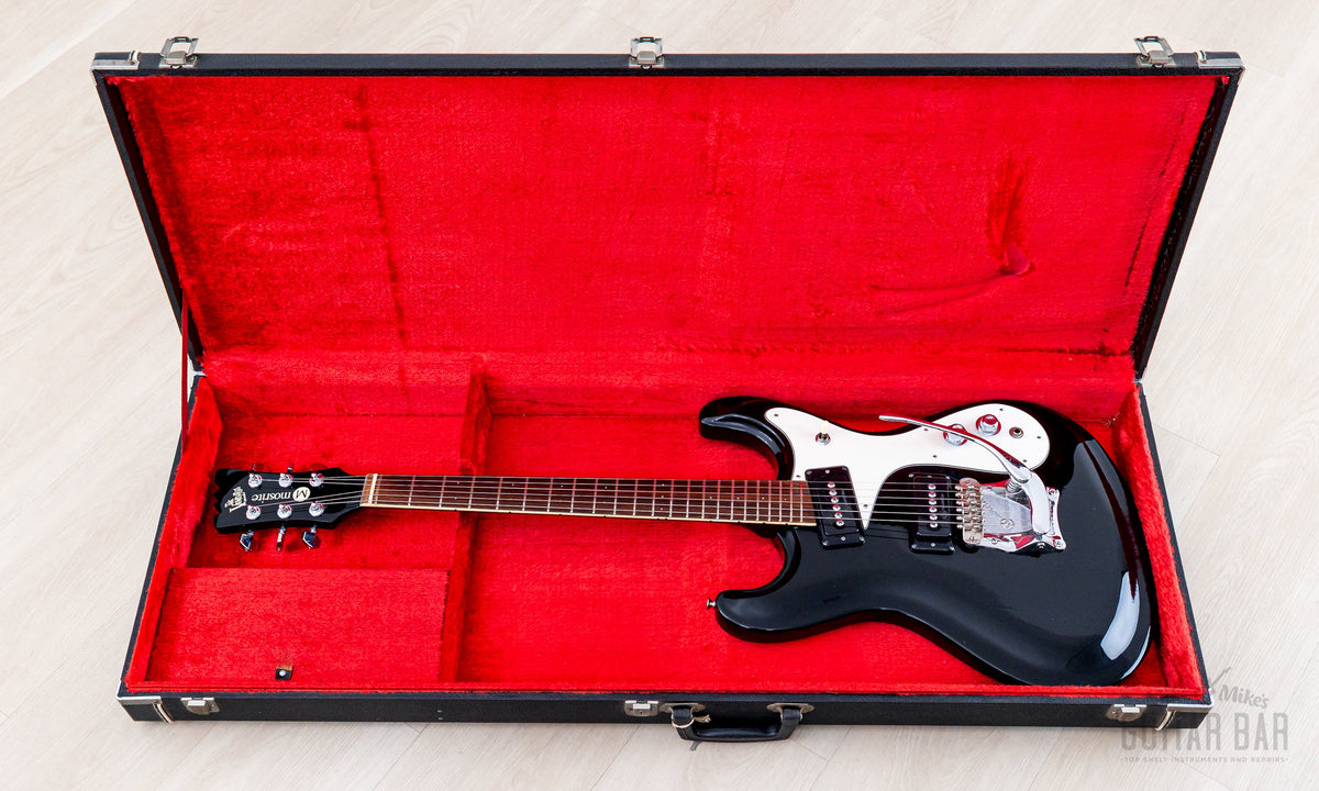 Firstman Mosrite Ventures Model in open hardshell case with red lining