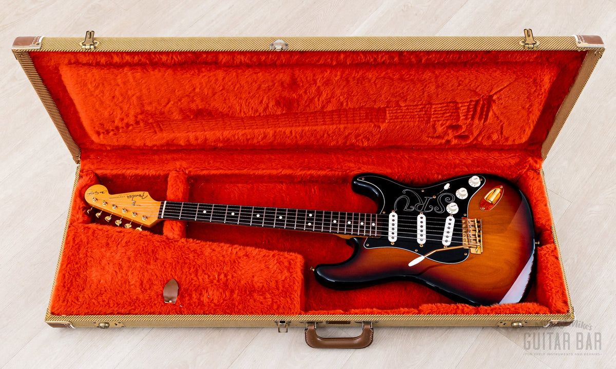 Guitar in open original tweed hardshell case