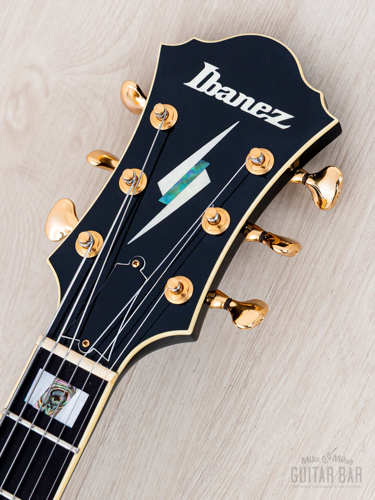 Ibanez PM100 headstock front with Ibanez logo and inlay
