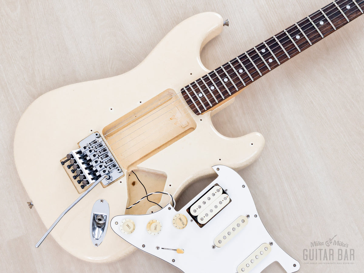 Pickguard lifted showing body routing