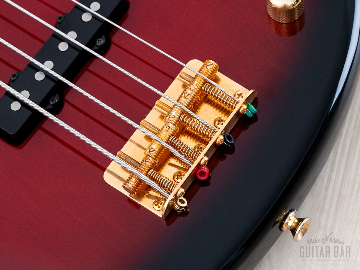 Close-up of gold bridge with threaded saddles