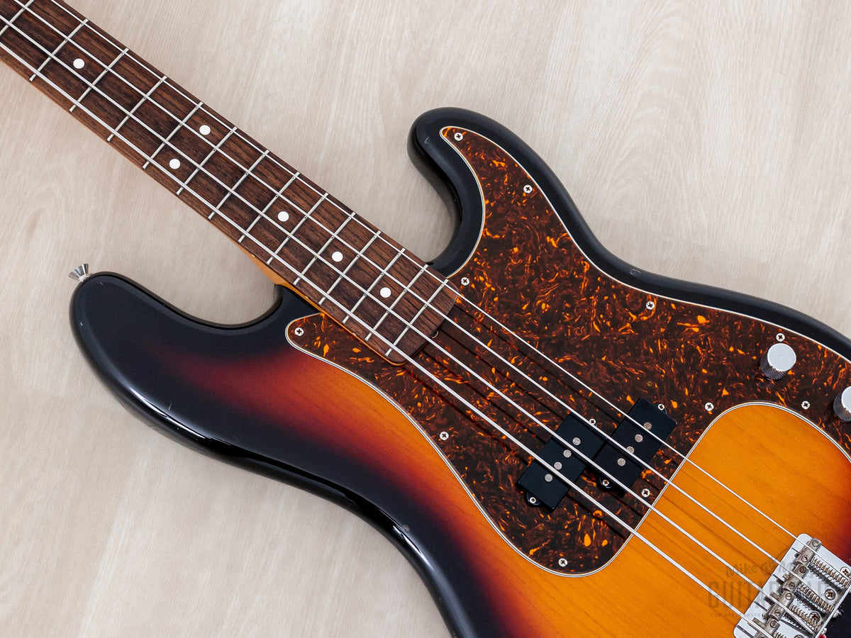 Close-up of pickguard, pickup and knurled knobs