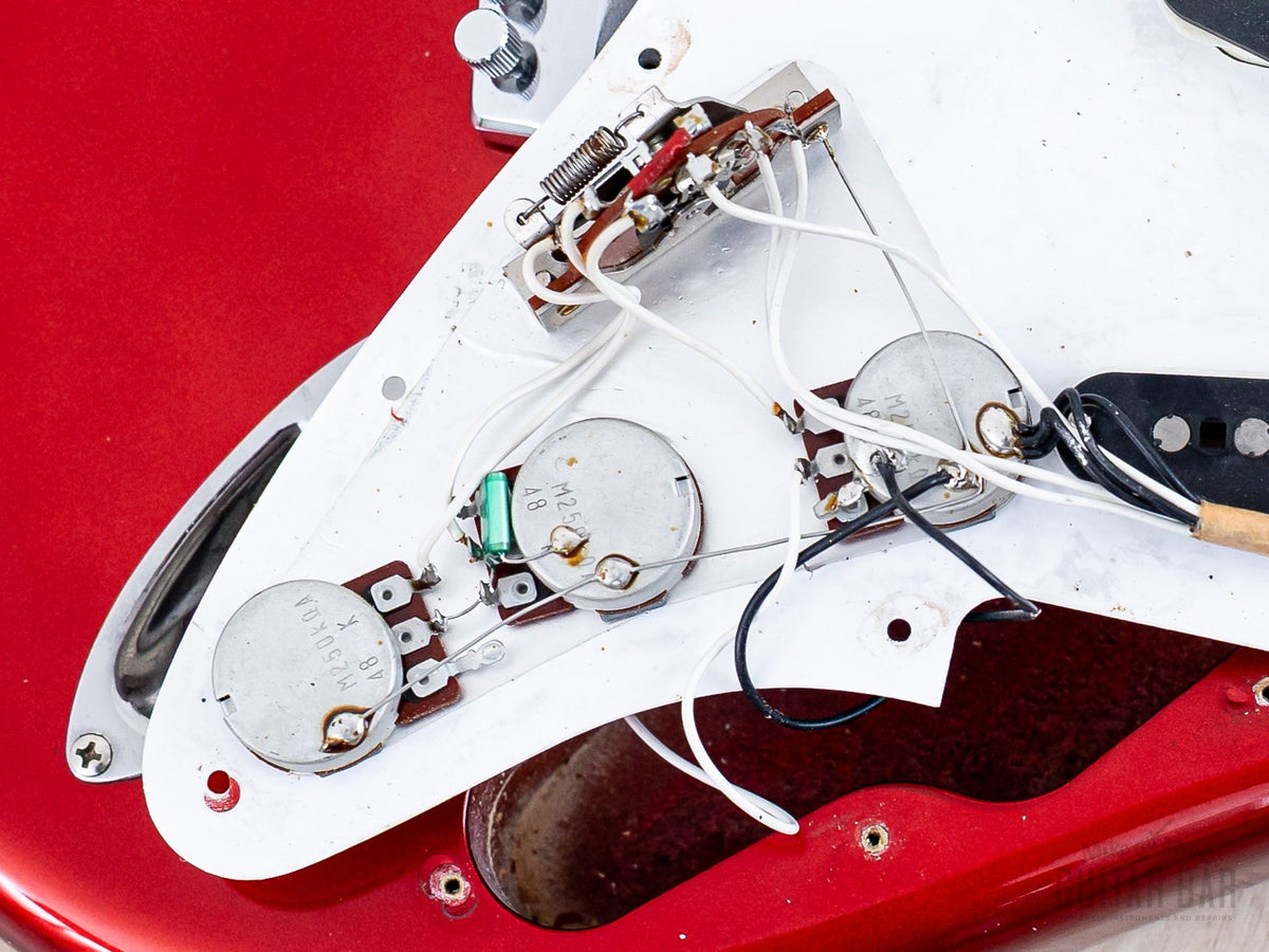 Original potentiometers and solder joints close-up