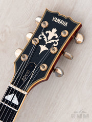 Yamaha SG1000 headstock front with logo and inlay