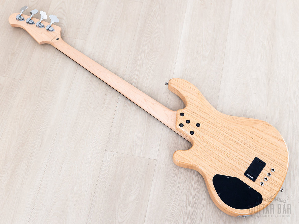 Back diagonal view showing ash body back and maple neck