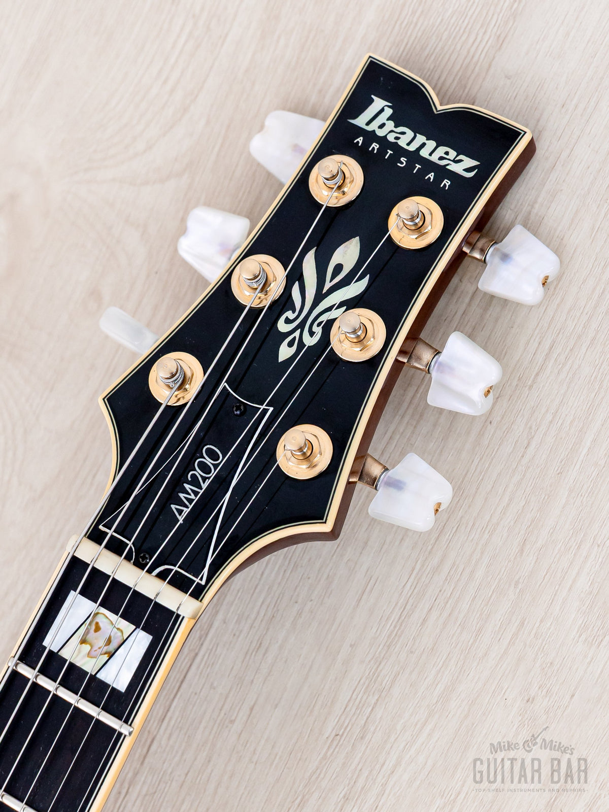 Ibanez AM200 headstock front with logo and inlay