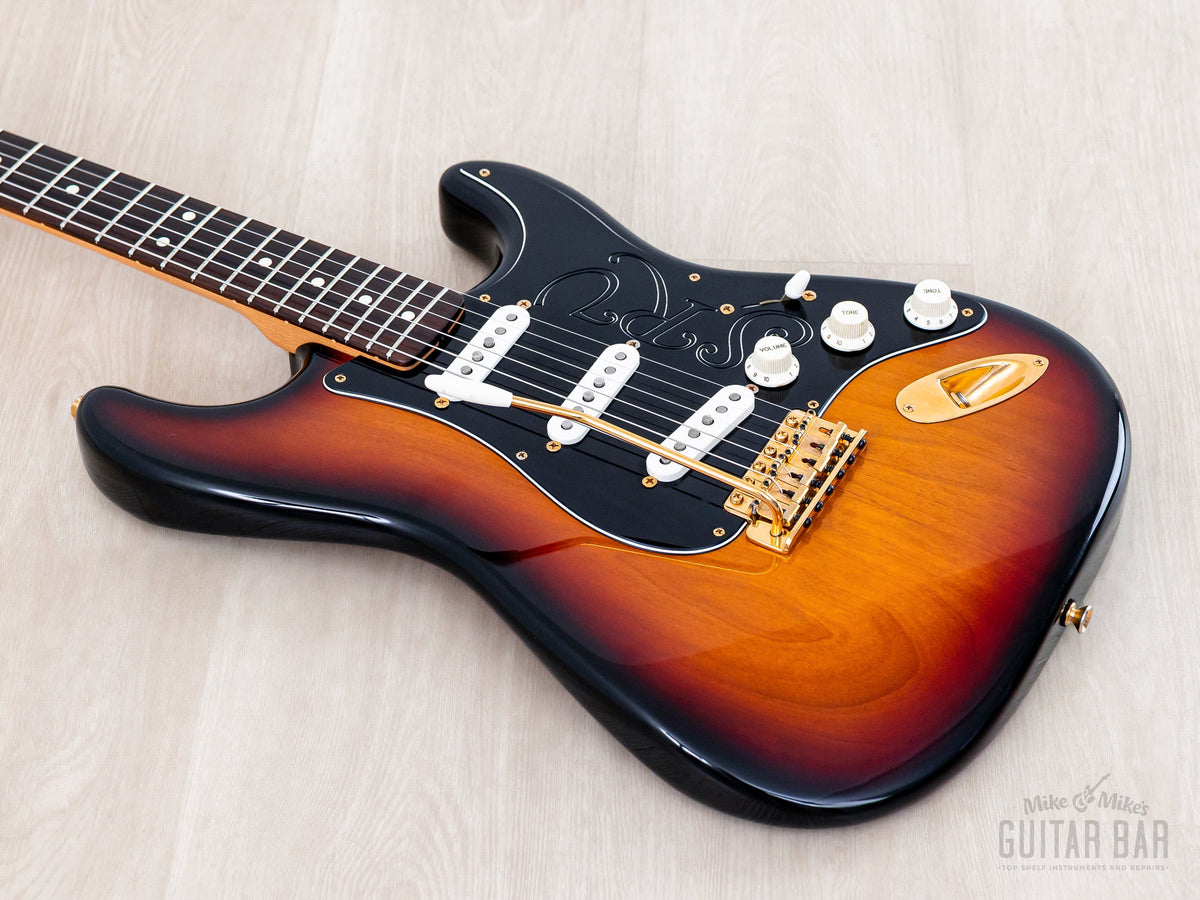 Angled front view of Sunburst body with left-handed tremolo arm placement