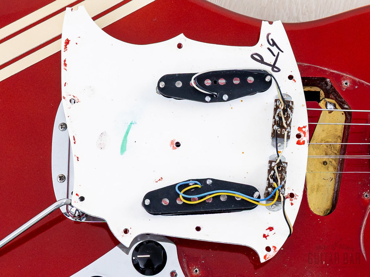 Under the pickguard, original pickups