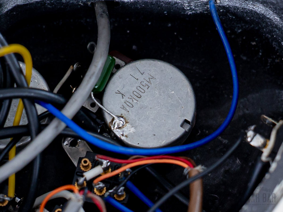 Control cavity wiring and pots close-up