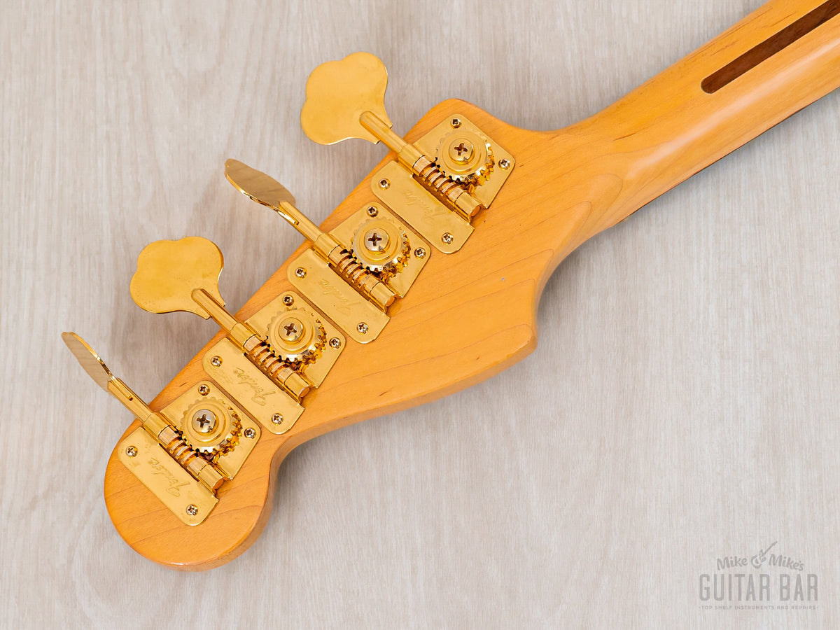 Headstock back with gold clover tuners