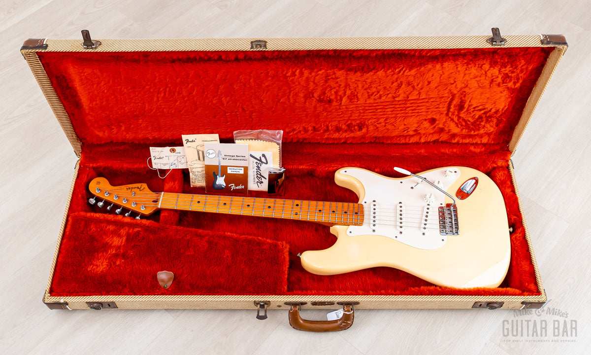 Guitar in the open tweed hardshell case