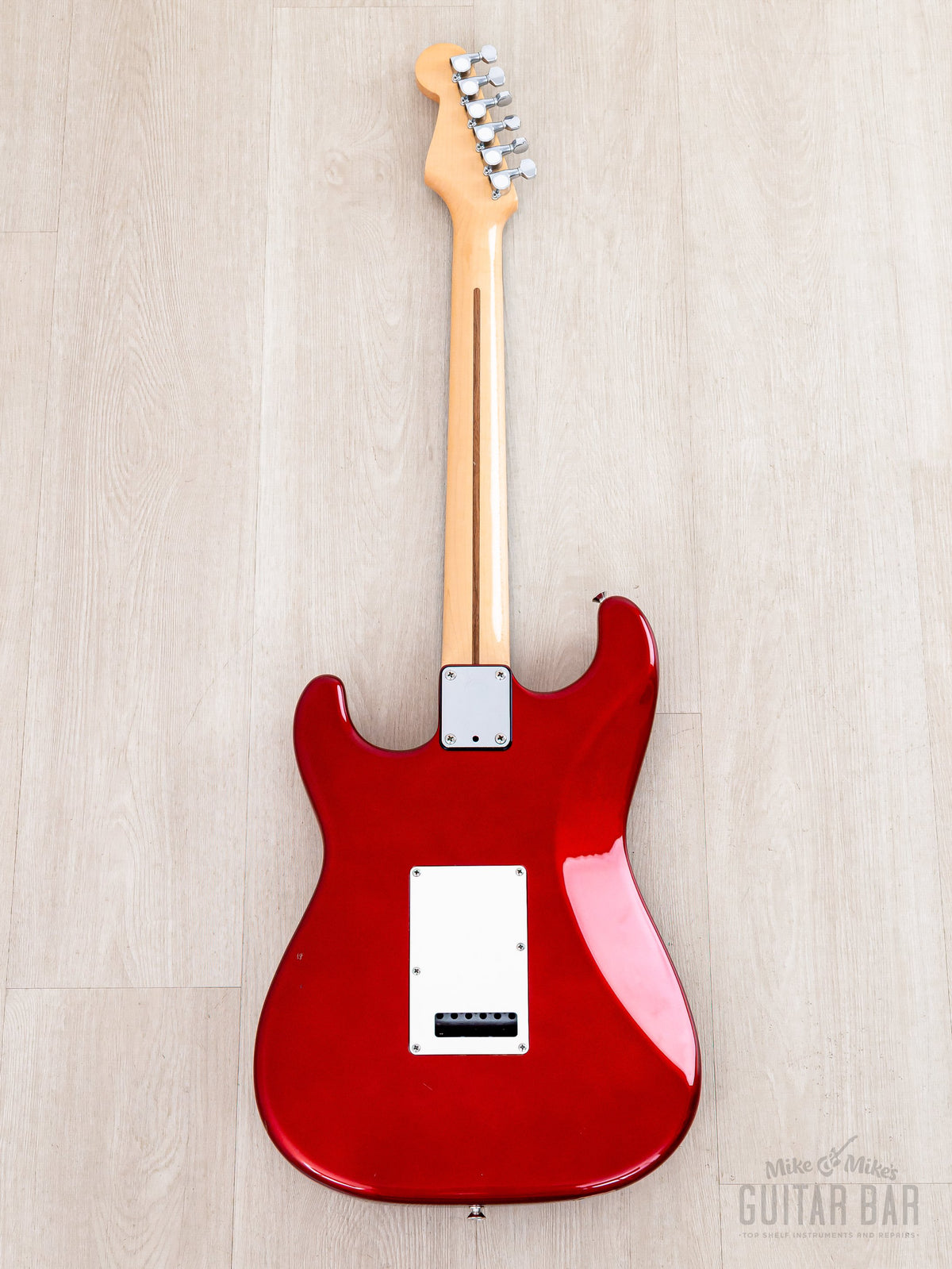 Full back view showing maple neck and body