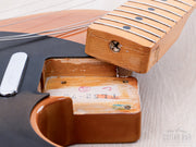 Neck pocket with model stamp, neck removed