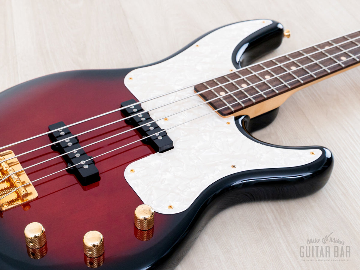 Low angle of body with two single-coil pickups and gold knobs