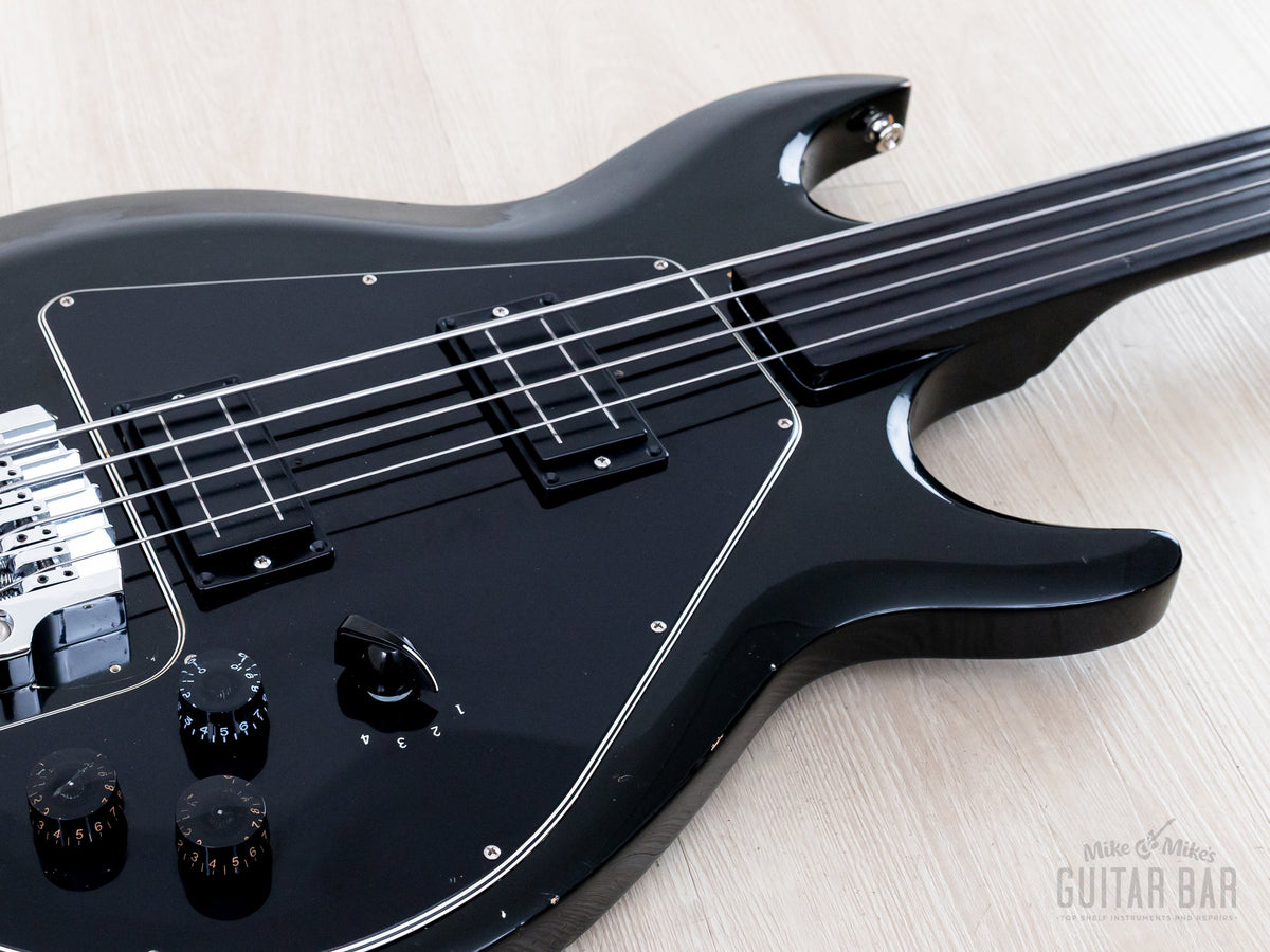 Ebony Ripper body and fretless neck, low angle view