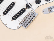 Bridge pickup and tremolo with block saddles close-up
