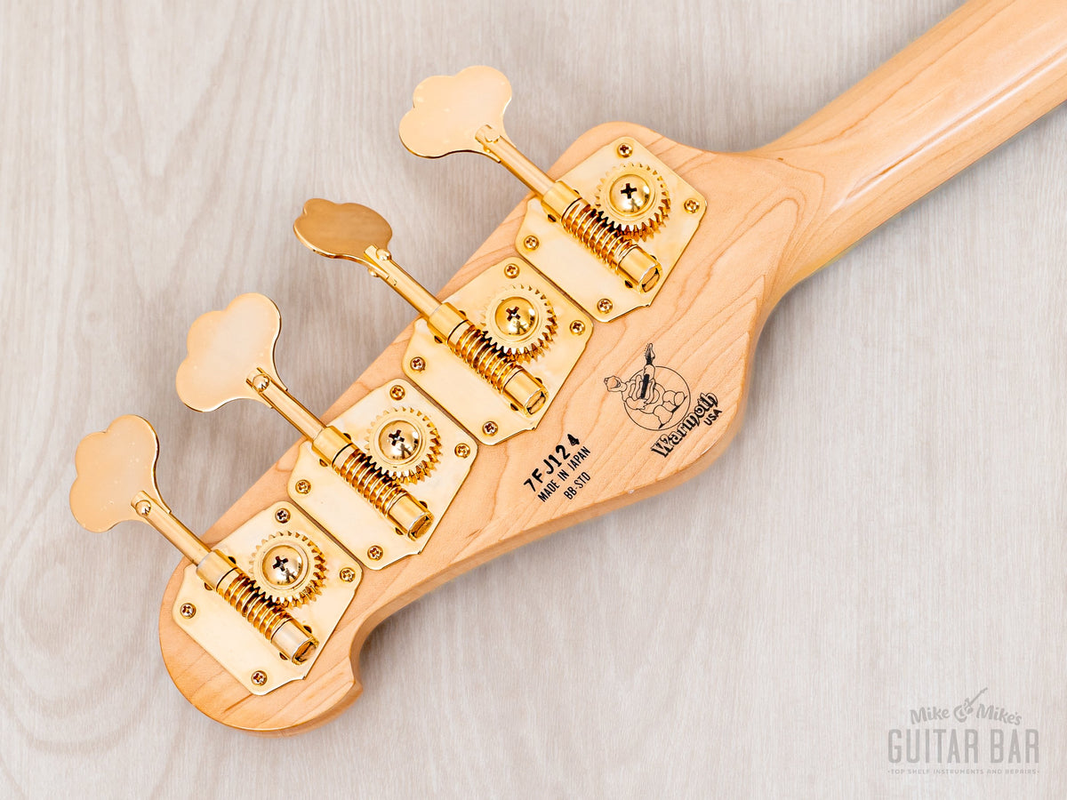Headstock back with gold clover tuners